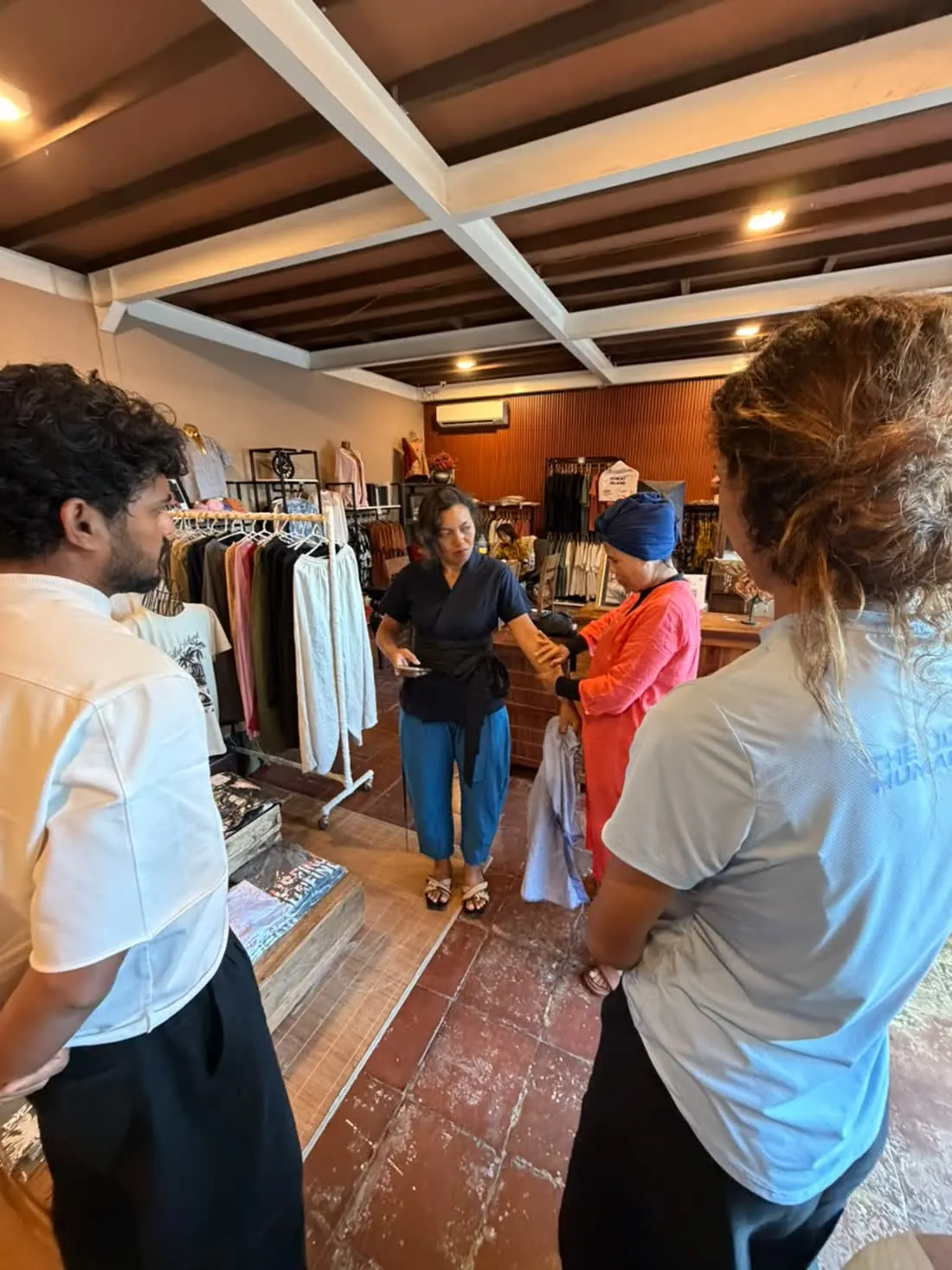 The Raha team choosing fabrics in a Bali atelier
