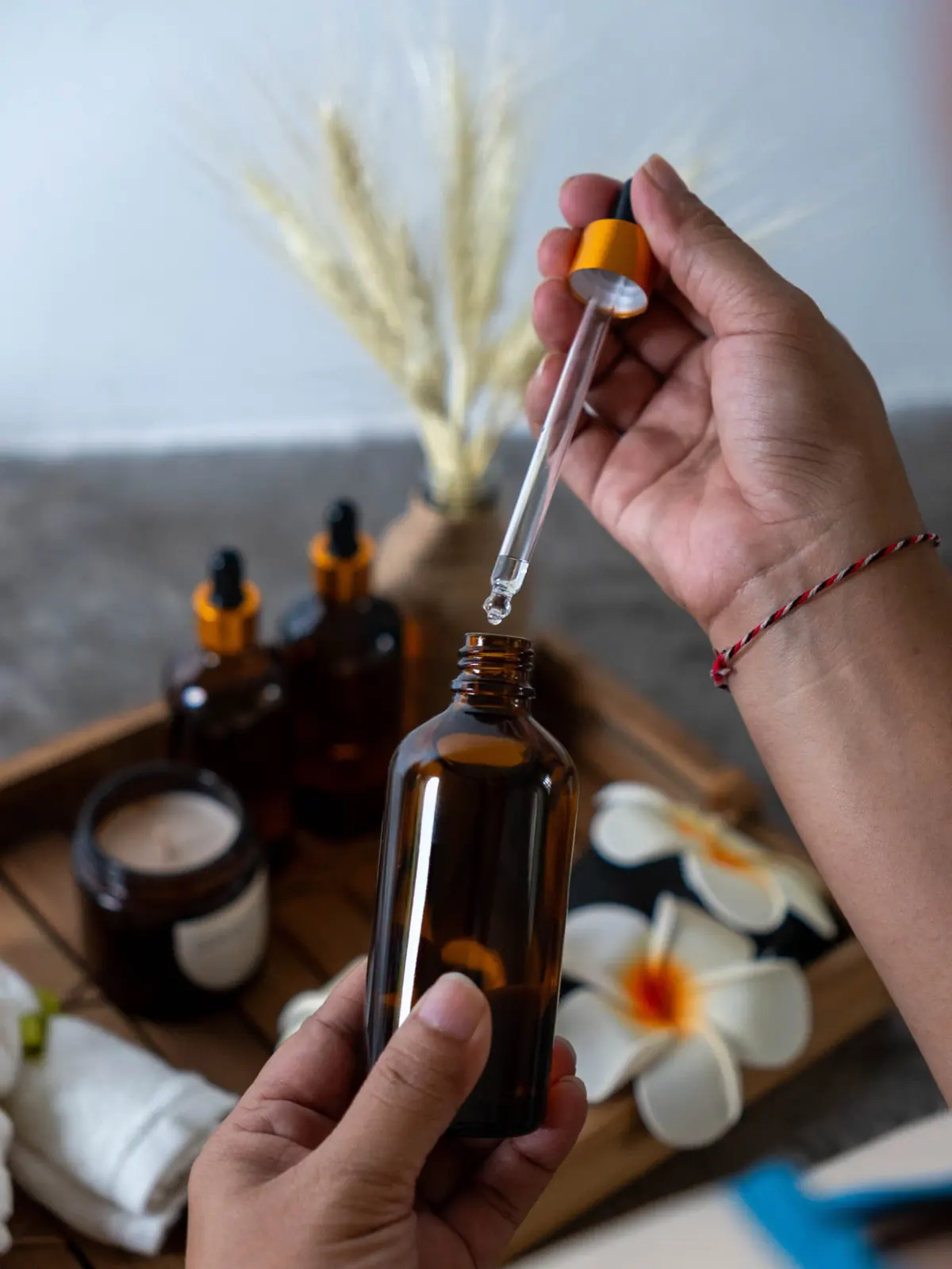 Natural essential oil being prepared with a glass dropper